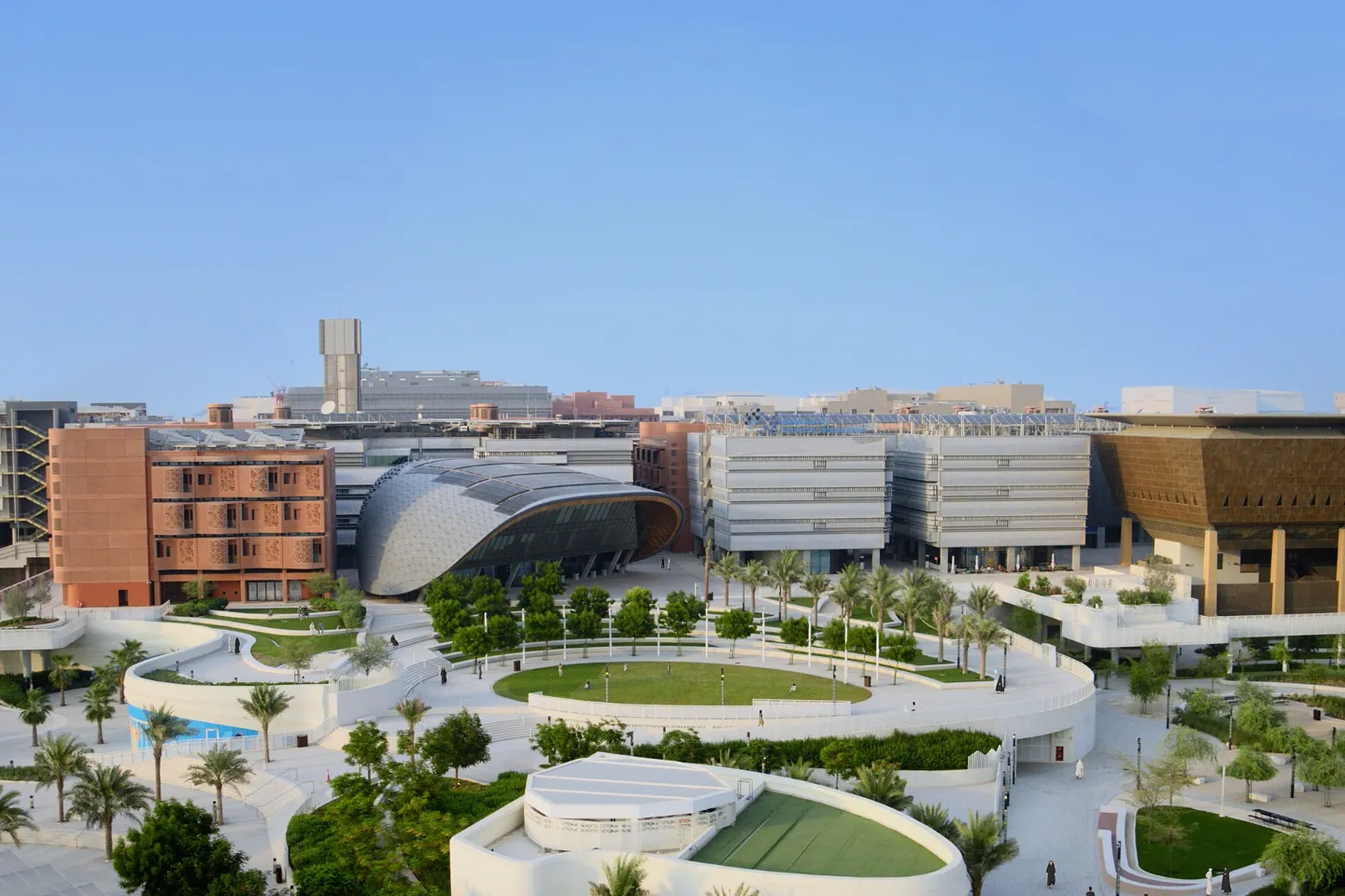 Low-rise buildings of Masdar City under a clear blue sky